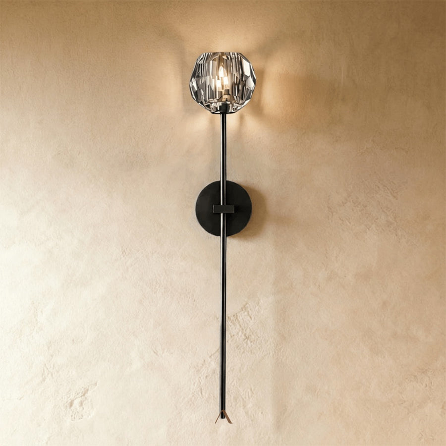 Cheux Wall Lamp — a wall lamp with a precision-cut crystal shade on a brushed iron base