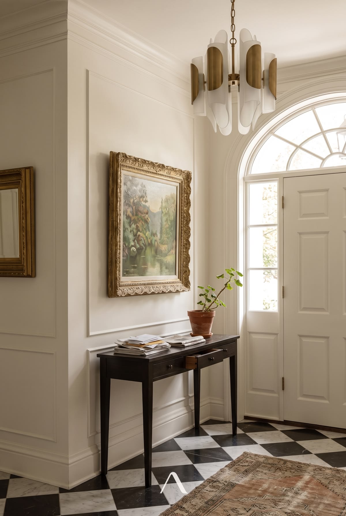 Entryway Chandelier Ideas — Sculptural Drop Over Marble Floor